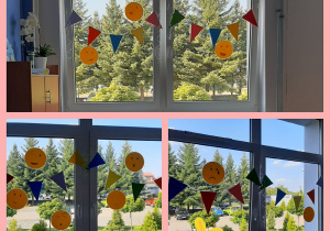 Dekoracja okienna w świetlicy. Kolorowe trójkąty zawiedzone na sznurku i żółte buźki przedstawiające emocje (uśmiech, smutek, radość, zdziwienie itd.).