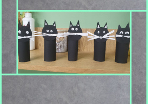 Kotki wykonane z czarnego papieru zrobione z okazji dnia czarnego kota.