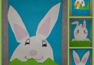 Głowa białego króliczka wystająca z trawy przedstawiona na niebieskim tle. Prace wykonane w gr. I przez uczniów kl. I i II.
